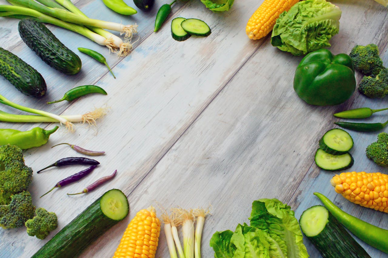 our-services-3 An assortment of fresh vegetables on a wooden table, perfect for healthy cooking.